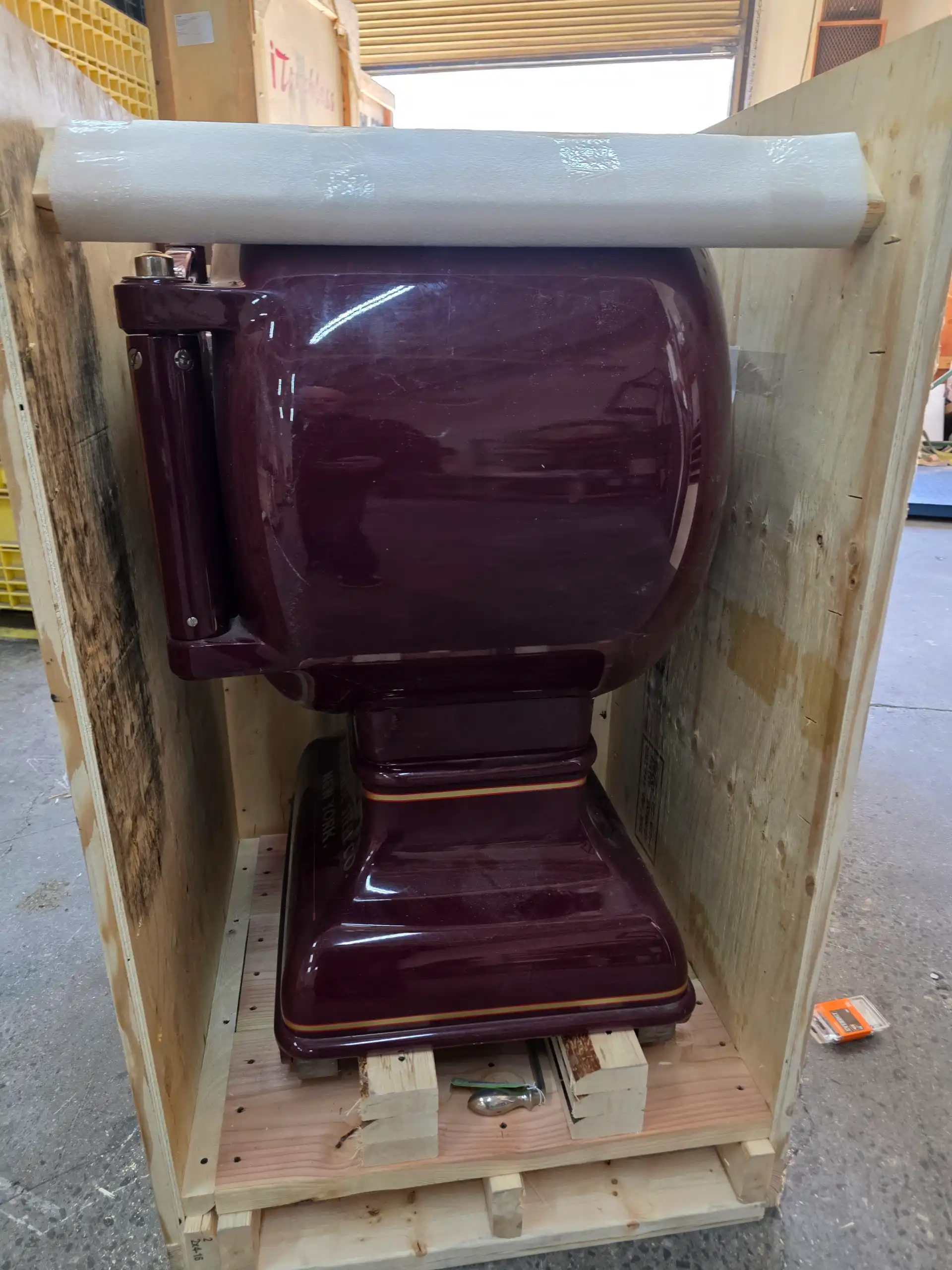 Staff inspecting industrial equipment before shipping